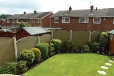 Natural gravel boards in existing concrete posts wit convex tops.